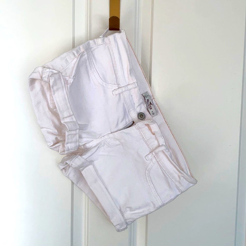 Lightly distressed Hollister white low-rise shorts